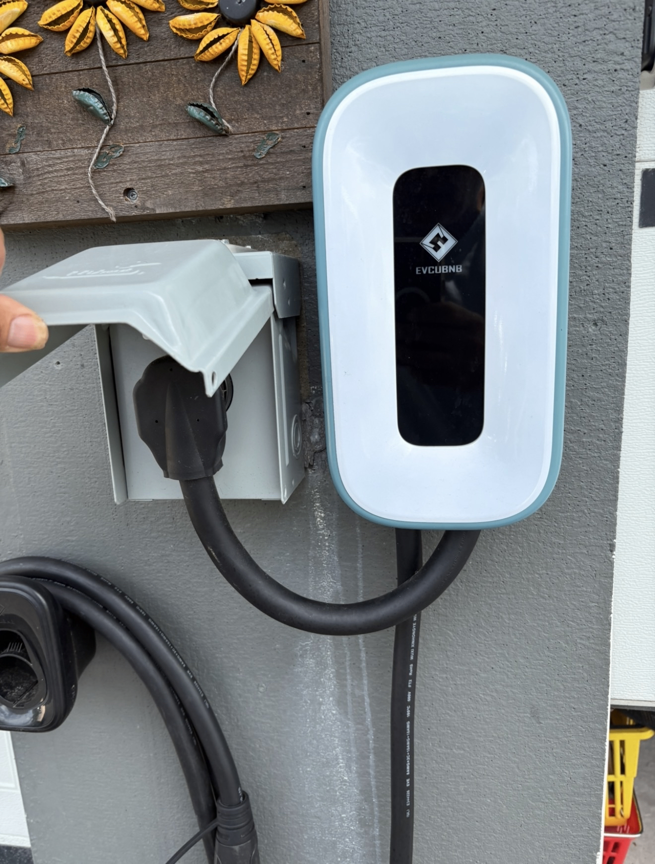 Smart EV charger installation with weatherproof outlet