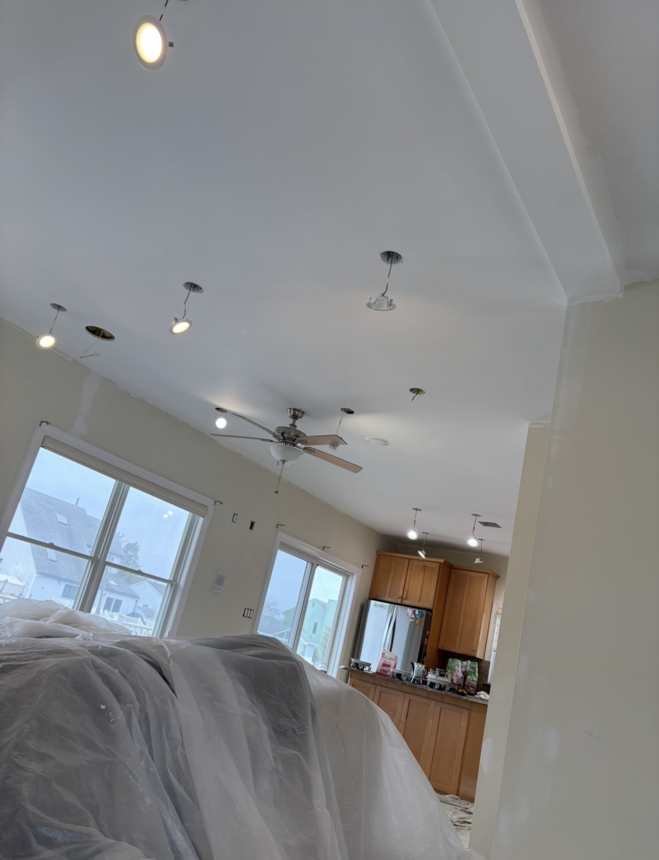 Recessed lighting and ceiling fan installation in open-concept home